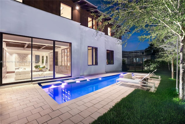 view of swimming pool with a patio