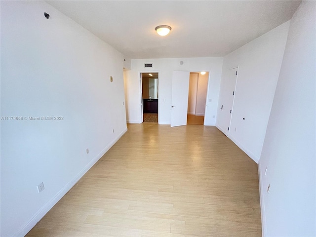 unfurnished room featuring light hardwood / wood-style floors