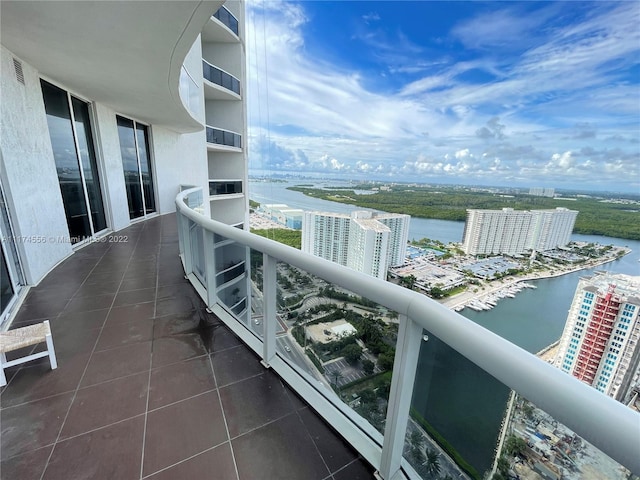 balcony featuring a water view