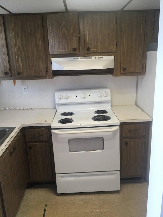 kitchen with dark brown cabinets and electric range