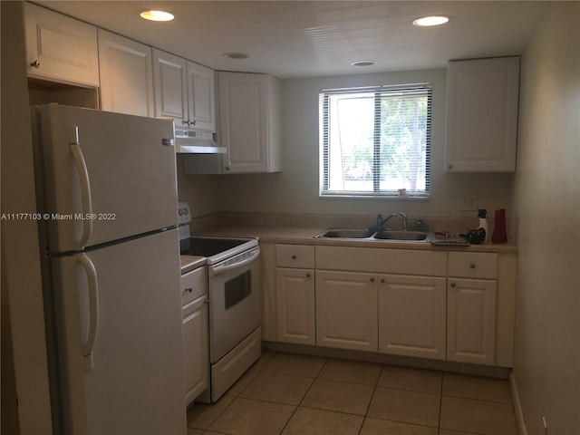 kitchen featuring white cabinetry, light tile patterned flooring, white appliances, and sink