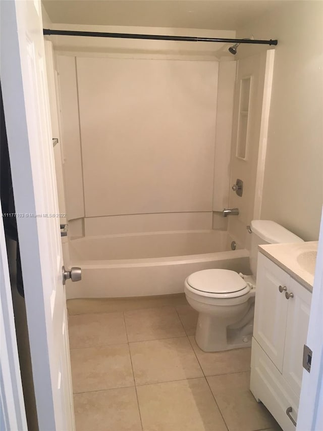 full bathroom with toilet, vanity, tile patterned floors, and shower / washtub combination