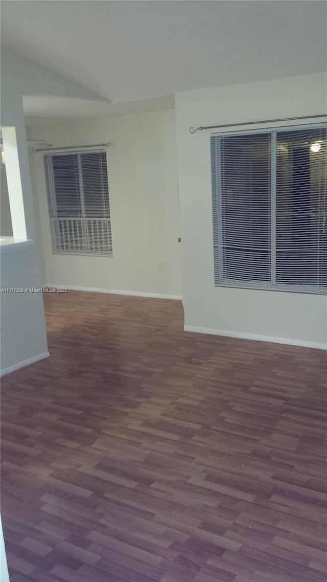 unfurnished room featuring dark hardwood / wood-style floors