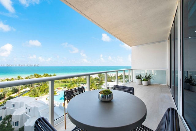 balcony featuring a water view