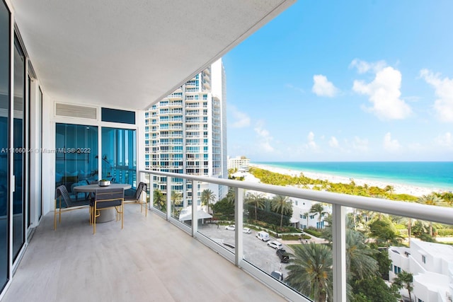 balcony featuring a water view