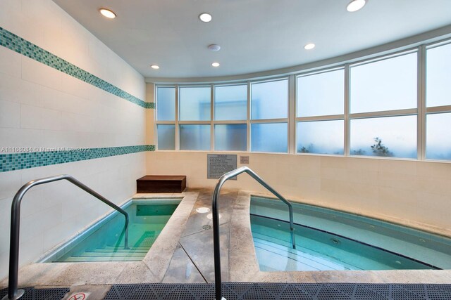 view of pool featuring an indoor in ground hot tub