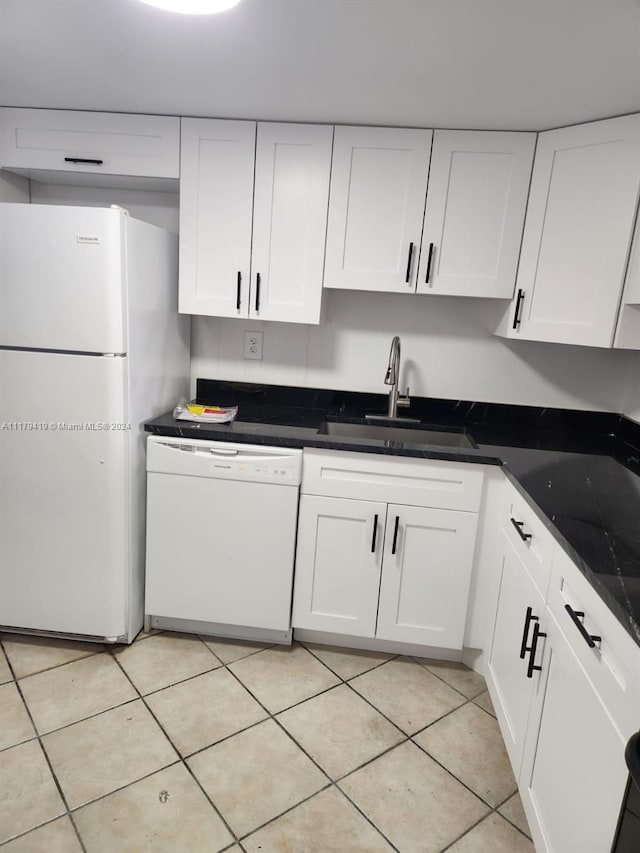 kitchen featuring white cabinets, white appliances, sink, and light tile patterned floors