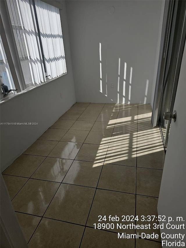 empty room featuring tile patterned floors