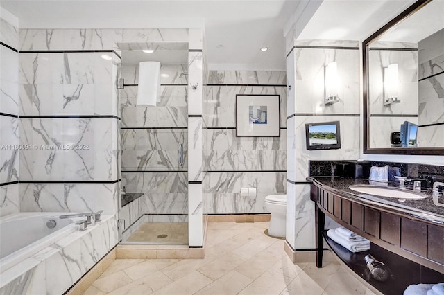 full bathroom featuring toilet, vanity with extensive cabinet space, shower with separate bathtub, tile walls, and tile flooring