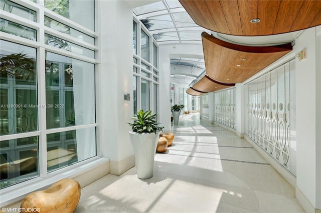 sunroom / solarium featuring wood ceiling