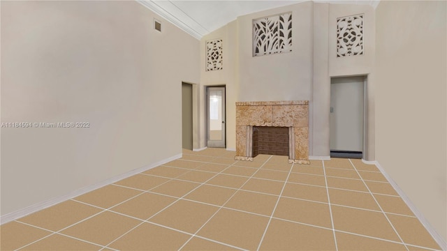 unfurnished living room with a towering ceiling, tile flooring, a premium fireplace, and crown molding