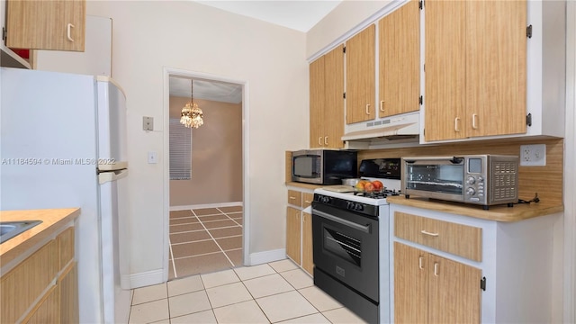 kitchen with a chandelier, light tile floors, white appliances, and decorative light fixtures