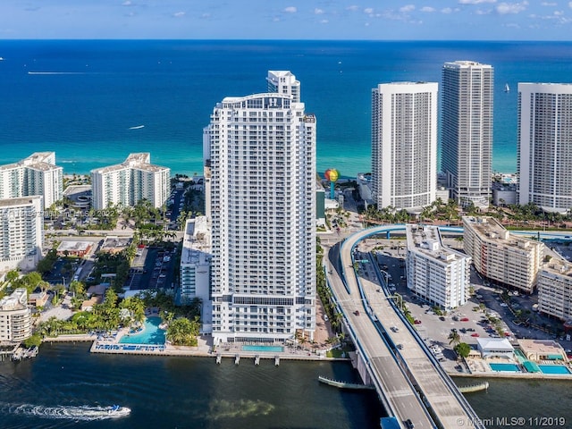 birds eye view of property featuring a water view