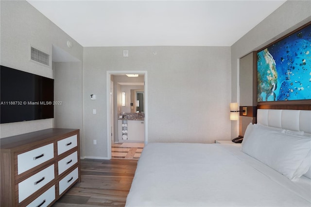 bedroom featuring dark wood-type flooring