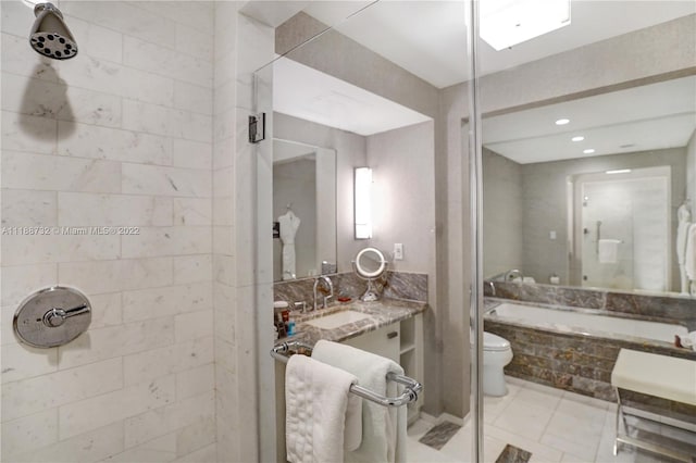 bathroom with vanity, tile floors, toilet, and tiled shower