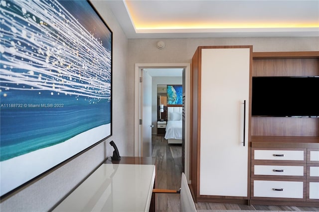 corridor with dark hardwood / wood-style flooring