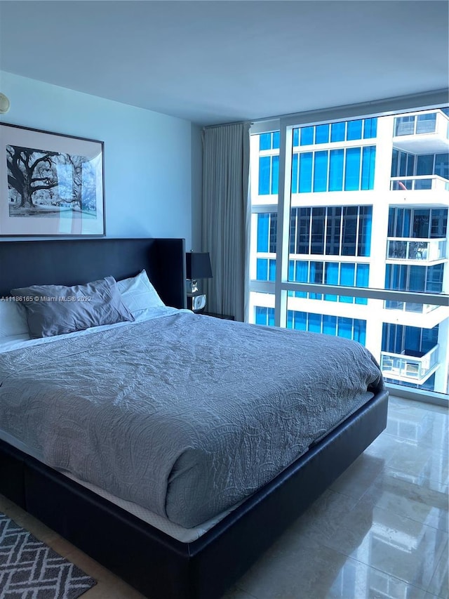 bedroom featuring dark tile flooring