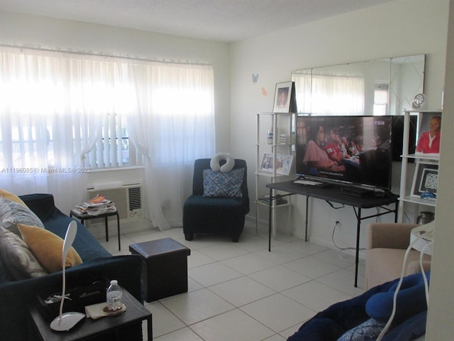 living room featuring plenty of natural light and light tile floors