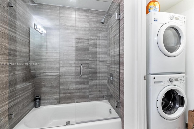 laundry area with stacked washer and clothes dryer