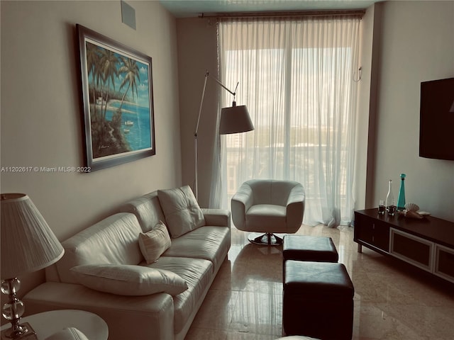 tiled living room with a wealth of natural light