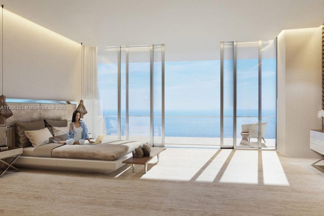 bedroom with a water view and expansive windows