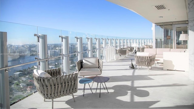 balcony featuring a water view