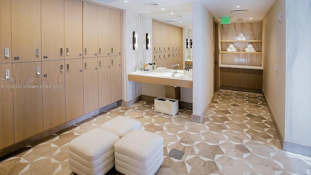 bathroom with tile flooring and sink