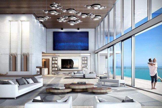 living room with a high ceiling, a notable chandelier, wooden ceiling, and a water view