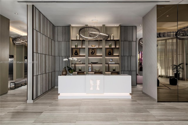 reception area featuring an inviting chandelier