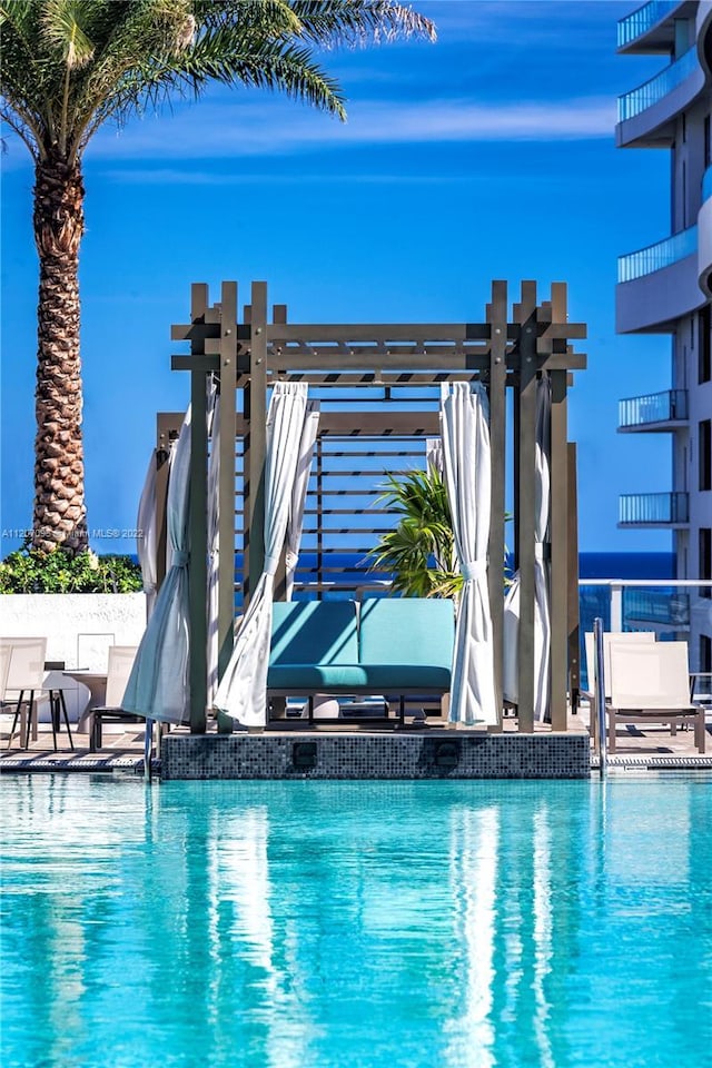 view of pool with a pergola