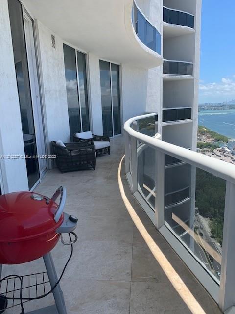 balcony featuring a water view