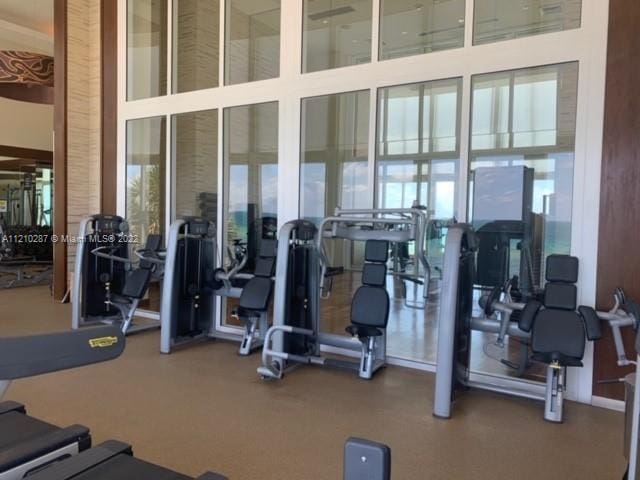 gym featuring a high ceiling