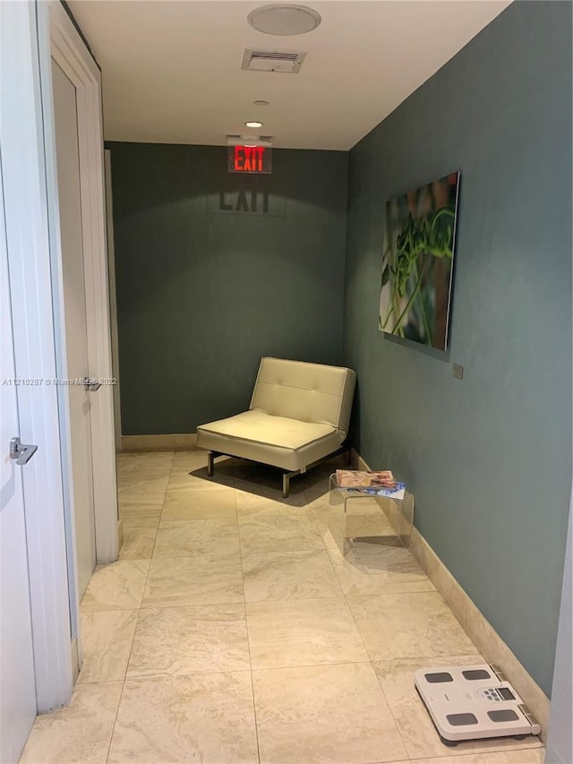 hallway featuring light tile floors