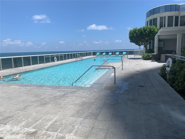 view of pool featuring a patio