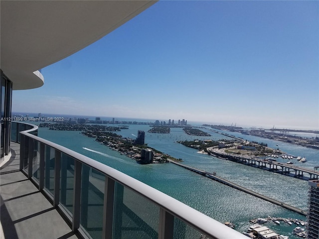 balcony featuring a water view