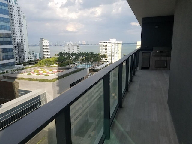 balcony featuring a water view