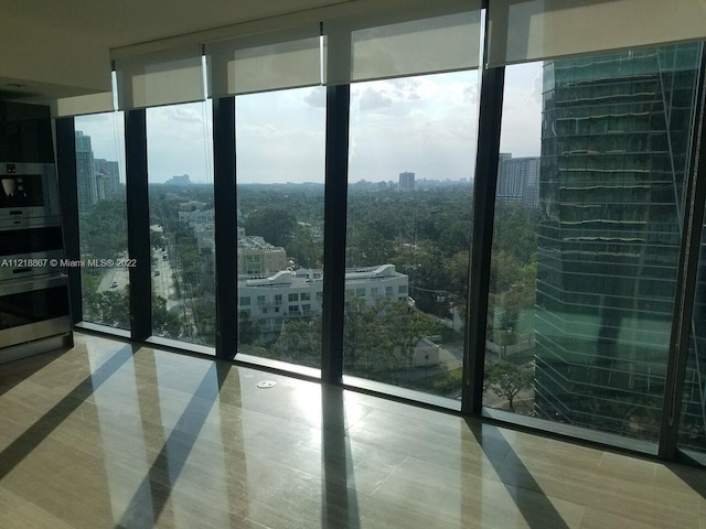 doorway with a healthy amount of sunlight and expansive windows