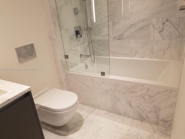 bathroom featuring vanity, tile floors, and toilet