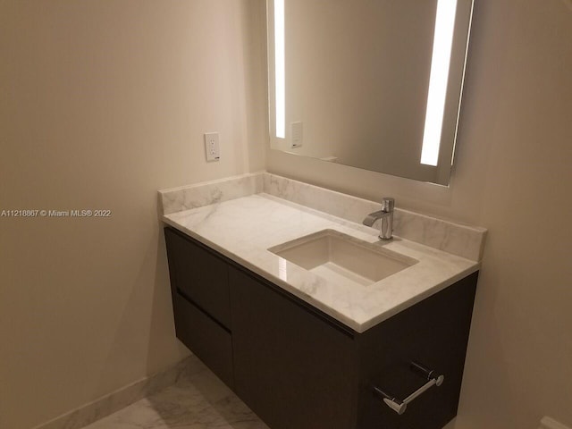 bathroom with vanity and tile flooring