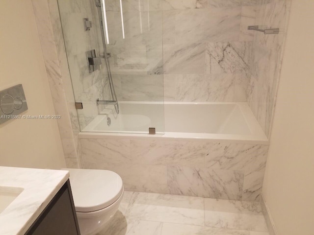 bathroom featuring vanity, tile floors, and toilet