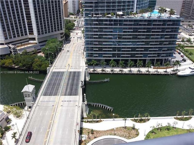 birds eye view of property with a water view