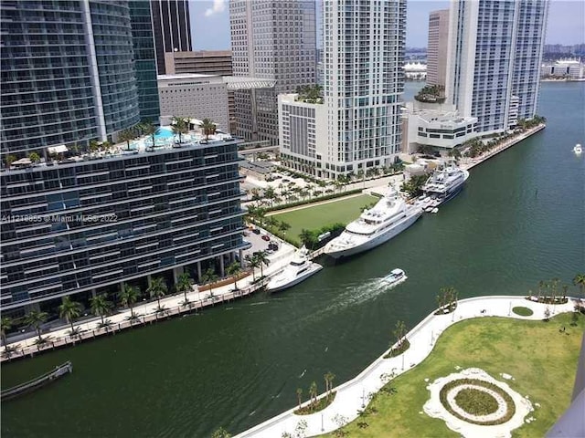 birds eye view of property with a water view