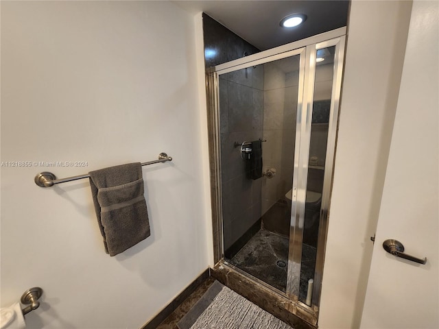 bathroom featuring an enclosed shower