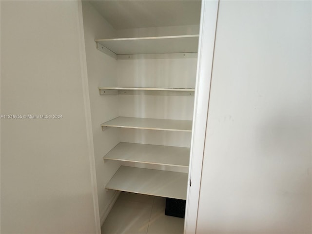 walk in closet featuring light tile patterned floors