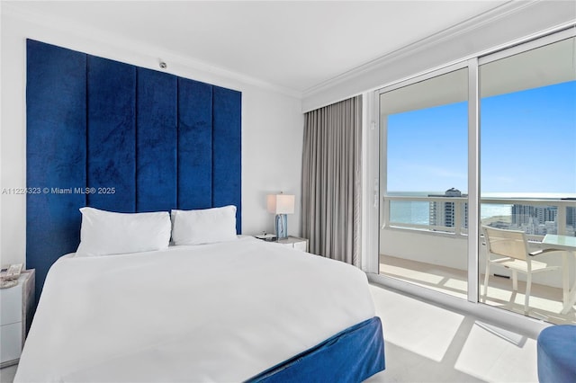 bedroom with a water view and ornamental molding