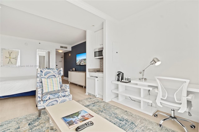 interior space with ensuite bath, crown molding, and light hardwood / wood-style flooring