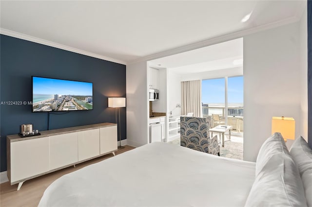 bedroom featuring light hardwood / wood-style flooring and crown molding