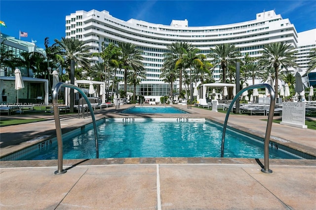 view of swimming pool with a patio area