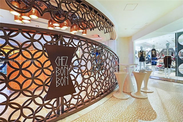 stairway featuring tile patterned flooring