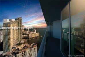 view of balcony at dusk